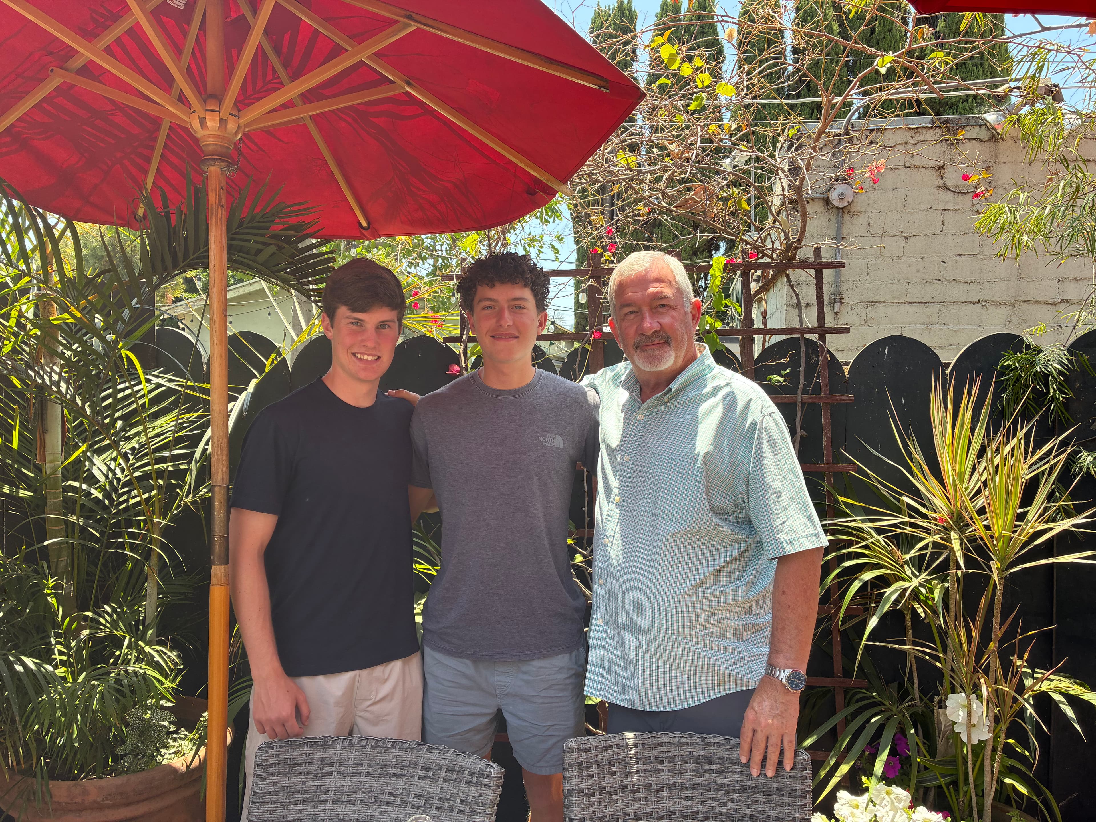 KneadLA team members with an advisor in a garden patio