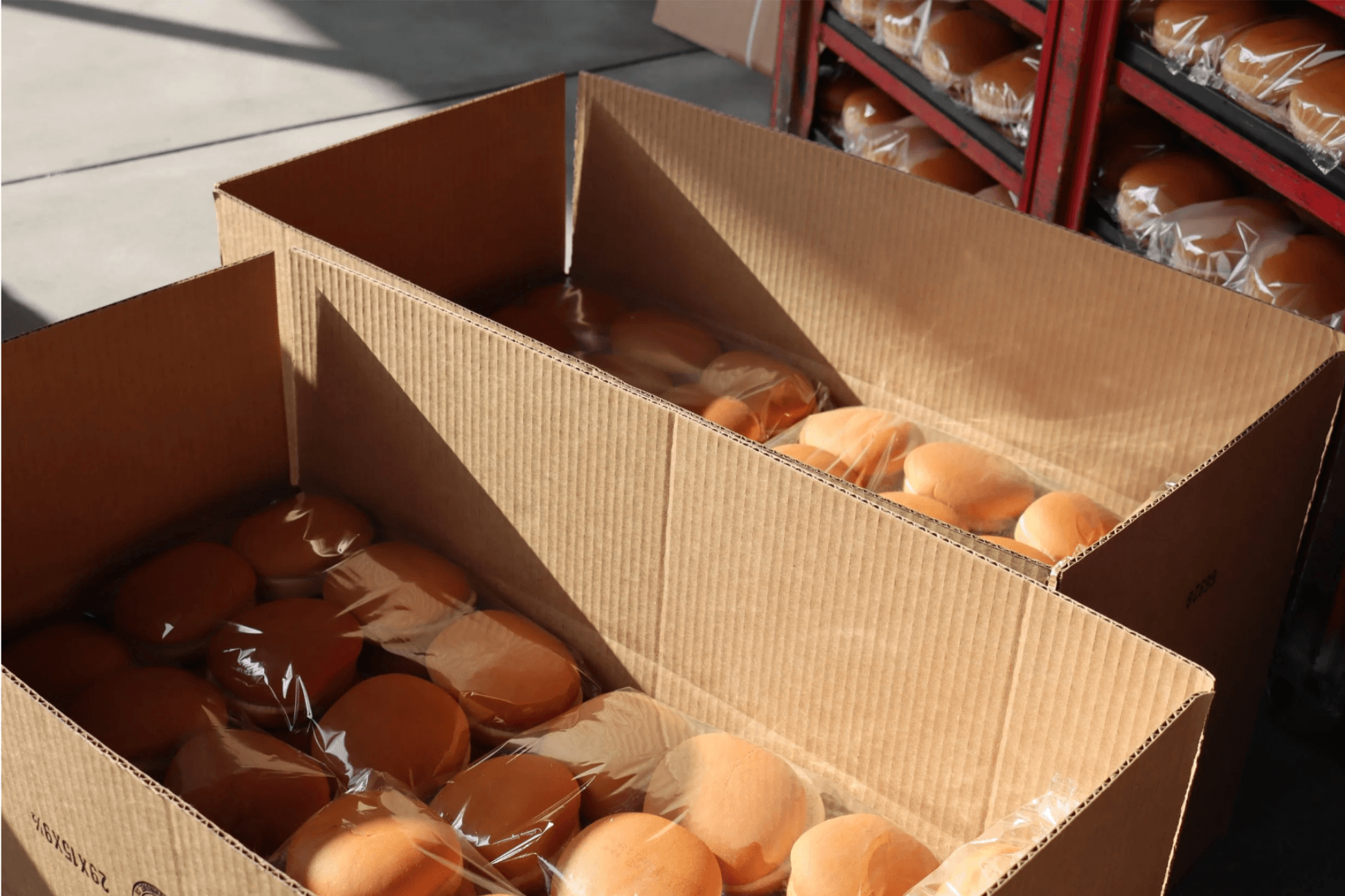 Boxes of surplus bread from bakery partner